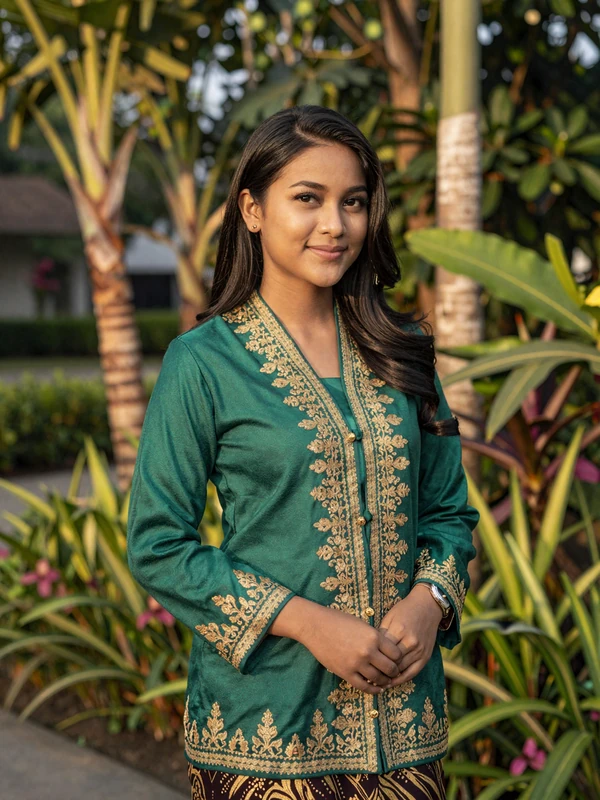 Bruneian woman in traditional baju kurung near Omar Ali Saifuddien Mosque representing Brunei Darussalam culture and Islamic values